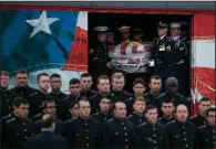  ?? AP/Austin American-Stateman/JAY JANNER ?? An honor guard carries the coffin of former President George H.W. Bush off the presidenti­al funeral train after it arrived Thursday at College Station, Texas.