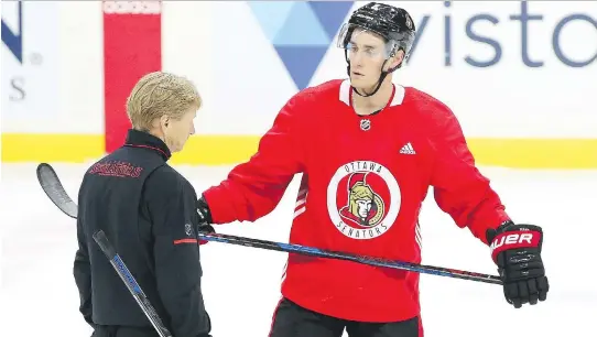  ?? JEAN LEVAC ?? Senators centre Kyle Turris listens to assistant coach Rob Cookson after Friday’s morning skate at Canadian Tire Centre. Turris isn’t expected to play until Monday’s game.