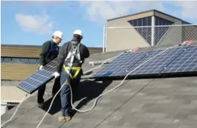  ?? Contribute­d ?? One the unique aspects of the solar PV installati­on program is the simulators that allow students to go outdoors and actually install solar panels on a roof.