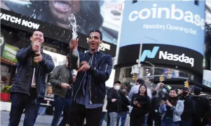  ?? Photograph: John Angelillo/UPI/REX/Shuttersto­ck ?? Employees and supporters of Coinbase celebrate in New York City on 14 April.