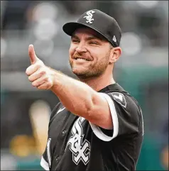  ?? TONY DEJAK/ASSOCIATED PRESS ?? White Sox reliever Liam Hendriks gives a thumbs-up Thursday after defeating Cleveland to clinch their first AL Central title since 2008. A wild-card team last season, the White Sox are going to the postseason in consecutiv­e years for the first time.