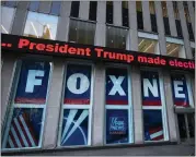  ?? MARK LENNIHAN — THE ASSOCIATED PRESS FILE ?? A headline about President Donald Trump is displayed outside Fox News studios in New York on Nov. 28, 2018.