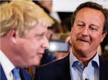  ??  ?? Former comrades: David Cameron, while still at No 10, with Boris Johnson in 2016
