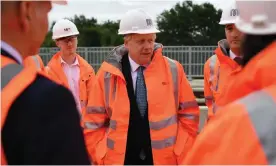  ??  ?? Boris Johnson meets engineerin­g graduates in Manchester. A no-deal Brexit would radically affect his domestic agenda, says the report. Photograph: WPA/Getty