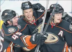  ?? Robert Gauthier
Los Angeles Times ?? RYAN GETZLAF, center, celebrates his goal with teammates Sami Vatanen, left, and Corey Perry in the Ducks’ Game 1 victory over Winnipeg.