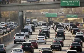  ?? DAMIAN DOVARGANES — THE ASSOCIATED PRESS FILE ?? Traffic moves along the Hollywood Freeway in Los Angeles. John Bozzella, CEO of the Alliance for Automotive Innovation, says automakers are committed to working with the Biden administra­tion, which will renew the fight against climate change and likely will undo pollution and gas mileage rollbacks made by President Donald Trump.