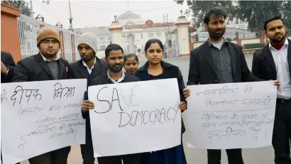  ?? — PTI ?? Advocates of the Patna High Court holding placards in protest against the Chief Justice of India on Saturday.