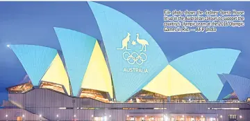  ?? — AFP photo ?? File photo shows the Sydney Opera House lit up in the Australian colours to support the country’s Olympic team at the 2016 Olympic Games in Rio.