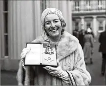  ?? AP 1975 ?? Singer Vera Lynn poses outside Buckingham Palace after being invested a Dame Commander of the British Empire. The family of World War II forces’ sweetheart Vera Lynn says she has died. She was 103 it was reported on Thursday.