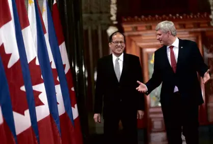  ?? MALACAÑANG PHOTO ?? HEARTWARMI­NG WELCOME President Aquino is welcomed by Canadian Prime Minister Stephen Harper to Parliament in Ottawa, Canada, on Friday. The President said the Philippine­s was now exploring an option to stop land reclamatio­n activities in the South China Sea even as his host called for calm among the rival claimants.