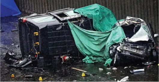  ??  ?? Carnage: Imtiaz Mohammed’s battered cab lies on its side, next to a car that appears to have been totally crushed