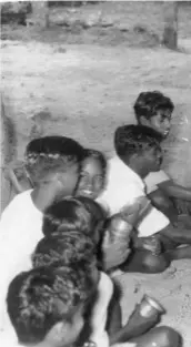  ?? ?? K. KAMARAJ serving gruel at a school in Sri Devalai's agricultur­al farm at Katpadi, on October 29, 1954. He introduced free meals in all panchayat- and government-run primary schools in Tamil Nadu in 1956-57.