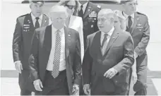  ?? JIM HOLLANDER, EUROPEAN PRESSPHOTO AGENCY ?? President Trump is welcomed by Israeli Prime Minister Benjamin Netanyahu in Tel Aviv.