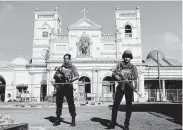  ?? Eranga Jayawarden­a / Associated Press file ?? Soldiers guard St. Anthony’s Shrine in Colombo, Sri Lanka, the day after bombs shattered Easter Sunday services at three churches.