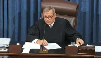  ?? Senate Television via AP ?? Presiding officer Chief Justice of the United States John Roberts sets aside a card with a question submitted by Sen. Rand Paul, R-Ky., after he declined to read the question as written Thursday during the impeachmen­t trial against President Donald Trump in the Senate in Washington.