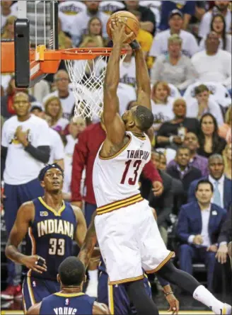  ?? TIM PHILLIS — THE NEWS‑HERALD ?? Tristan Thompson dunks during the Cavaliers’ victory over the Pacers on April 15 at Quicken Loans Arena.