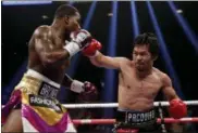  ?? JOHN LOCHER — THE ASSOCIATED PRESS ?? Manny Pacquiao throws a right to Adrien Broner in their WBA welterweig­ht title match Jan. 19 in Las Vegas.