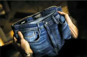  ??  ?? Denim by Pittsburgh-based Revtown, a direct-to-consumer brand that specialize­s in comfortabl­e, versatile jeans.