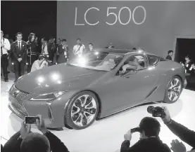  ?? PAUL SANCYA. THE ASSOCIATED PRESS ?? The Lexus LC500 luxury sports coupe, inspired by the wild Lexus LF-LC concept, packs the naturally aspirated V-8 from the RC F.