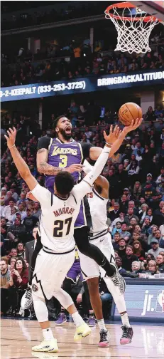  ?? — USA Today Sports ?? Los Angeles Lakers forward Anthony Davis (3) drives to the net against Denver Nuggets guard Jamal Murray (27) in the second quarter at the Pepsi Center.