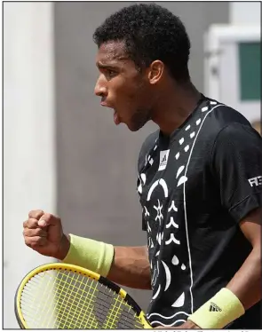  ?? Michel Euler The Associated Press ?? Felix Auger-aliassime, who is coached by Rafael Nadal’s uncle, will face Nadal in the fourth round of the French Open.