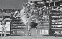  ?? [PHOTO PROVIDED] ?? Hulbert cowboy Ryan Dirteater rides the Oklahoma bull SweetPro’s Bruiser to the championsh­ip of the PBR’s Express Employment Profession­als Invitation­al at Chesapeake Energy Arena on Sunday.