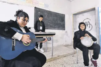  ?? ?? Students attend a music class financed by the after-school club Tunisia 88, at the Haffouz secondary school in Tunisia’s northern Kairouan region, Feb. 2, 2024.