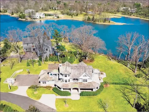  ?? Contribute­d photo ?? This spacious home, with its private natural waterfront setting filled with abundant wildlife, features 16 rooms, including a large custom kitchen, and offers beautiful flow throughout.