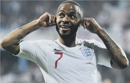  ??  ?? 0 Raheem Sterling responds to chanting from Montenegro fans as he celebrates scoring England’s fifth goal in the Euro 2020 qualifier.