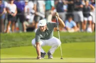  ?? Mel Evans / Associated Press ?? Bryson DeChambeau eyes his putt as he places his ball on the green at the 18th hole during the third round of the Northern Trust Saturday in Paramus, N.J.