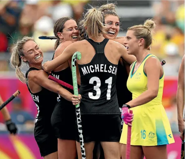  ??  ?? The Black Sticks react after beating Australia 4-1 in the women’s hockey final on the Gold Coast yesterday.