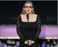  ?? PHOTO BY VINCE BUCCI/INVISION/AP, FILE ?? In this 2015, photo, Carrie Fisher presents the life achievemen­t award on stage at the 21st annual Screen Actors Guild Awards at the Shrine Auditorium in Los Angeles. Fisher was reportedly transporte­d to a hospital after suffering a severe medical...