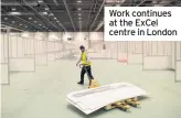  ??  ?? Work continues at the ExCel centre in London