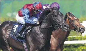  ?? LORRAINE O’SULLIVAN/PA ?? Los Angeles (left) and Wayne Lordan surge to victory by a length