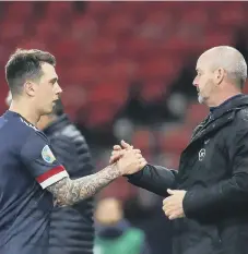  ??  ?? Scotland’s Ryan Jack and manager Steve Clarke.