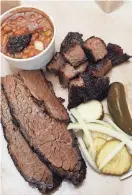  ?? ?? The burnt ends with brisket and beans is one of the popular choices at City Butcher in south Springfiel­d.