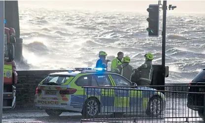  ?? Picture: Gareth Jennings. ?? Rescue services on Riverside Drive during the storm.