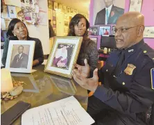  ?? STAFF PHOTO BY PATRICK WHITTEMORE ?? ‘BLAMED MYSELF’: Capt. Haseeb Hosein, right, sits with Mary Franklin, left, and Nichole Bell, who show photos of their slain loved ones.