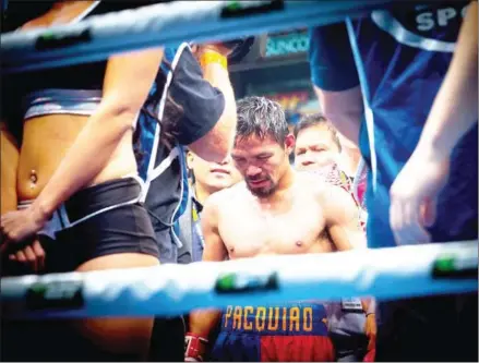  ?? AFP ?? Manny Pacquiao leaves the ring following his defeat to Jeff Horn in their World Boxing Organisati­on welterweig­ht boxing match at Suncorp Stadium in Brisbane on Sunday.