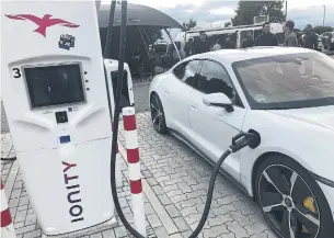  ??  ?? It took a little more than 22 minutes to top up the power supply on this Porsche Taycan Turbo S at a charging station centre on a German Autobahn.