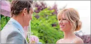  ?? DAVID DOLSEN ?? Debbie Gibson and Robert Gant play sweetheart­s in the Hallmark Channel’s movie “Wedding of Dreams,” premiering Saturday.