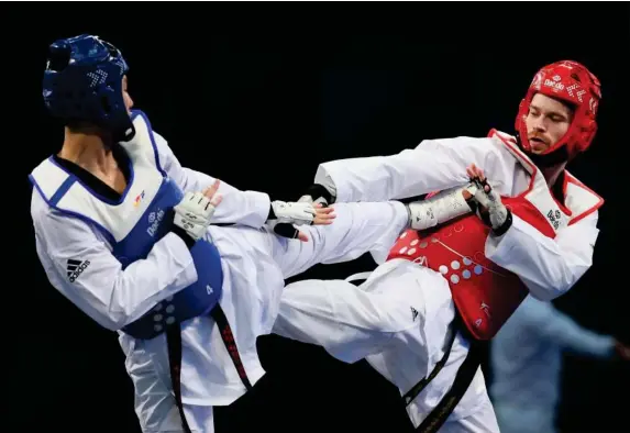  ?? (Getty) ?? Team GB taekwondo star Aaron Cook (right)