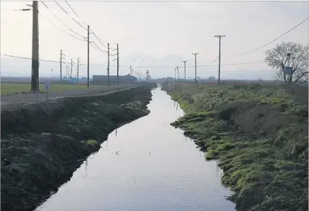  ?? Katie Falkenberg Los Angeles Times ?? WHETHER the board of the Metropolit­an Water District of Southern California commits to paying roughly a quarter of the $17-billion bill for the twin delta tunnels could make or break the project. Above, a canal along Highway 4 outside Stockton.