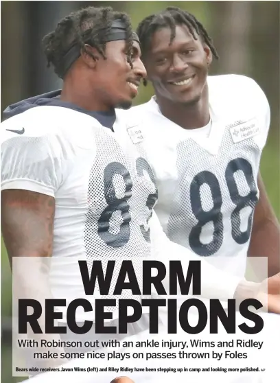  ?? AP ?? Bears wide receivers Javon Wims (left) and Riley Ridley have been stepping up in camp and looking more polished.