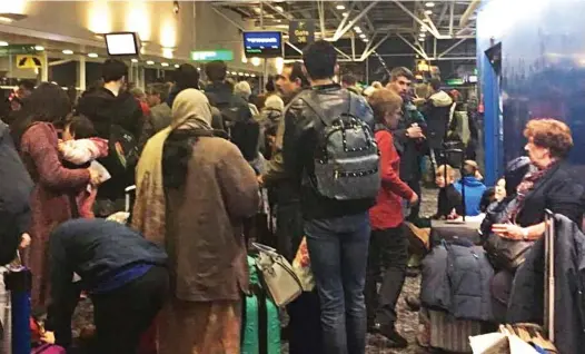  ??  ?? Going nowhere: Passengers posted social media pictures of shambolic scenes at Stansted after their flights were cancelled