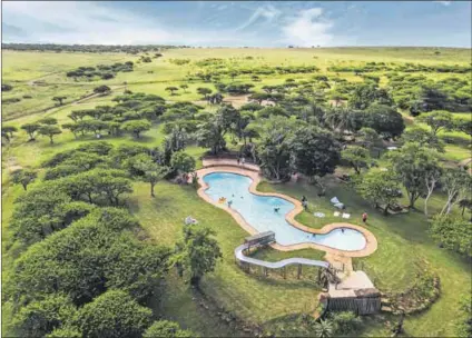  ?? Photos: Christophe­r Allan ?? Tranquil setting: The swimming pool at Tala Game Reserve (above) and one of the rooms (left). Some of the lodges are being refurbishe­d while business is quiet.