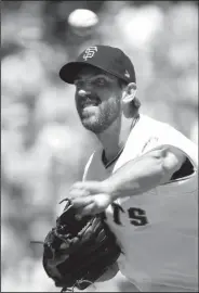  ?? KARL MONDON/TRIBUNE NEWS SERVICE ?? Giants starting pitcher Madison Bumgarner pitches against the St. Louis Cardinals on July 8 in San Francisco.
