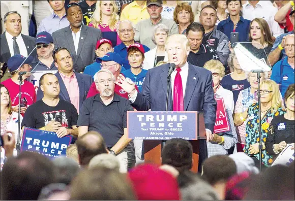  ??  ?? US Republican presidenti­al candidate Donald Trump addresses supporters at the James A. Rhodes Arena on Aug 22 in Akron, Ohio. Trump currently trails Democratic presidenti­al candidate Hillary
Clinton in Ohio, a state which is critical to his election...