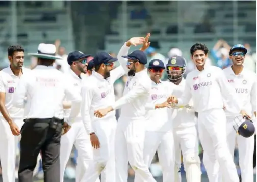  ??  ?? Indian players celebrate after their victory over England in the second Test match in Chennai on Tuesday.
