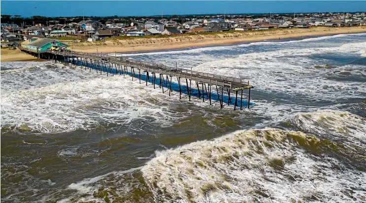  ?? AP ?? Waves continue to pound the Avalon pier after a large portion of the pier was washed away by Hurricane Dorian which moved through the Kill Devil Hills, North Carolina, area on Saturday.